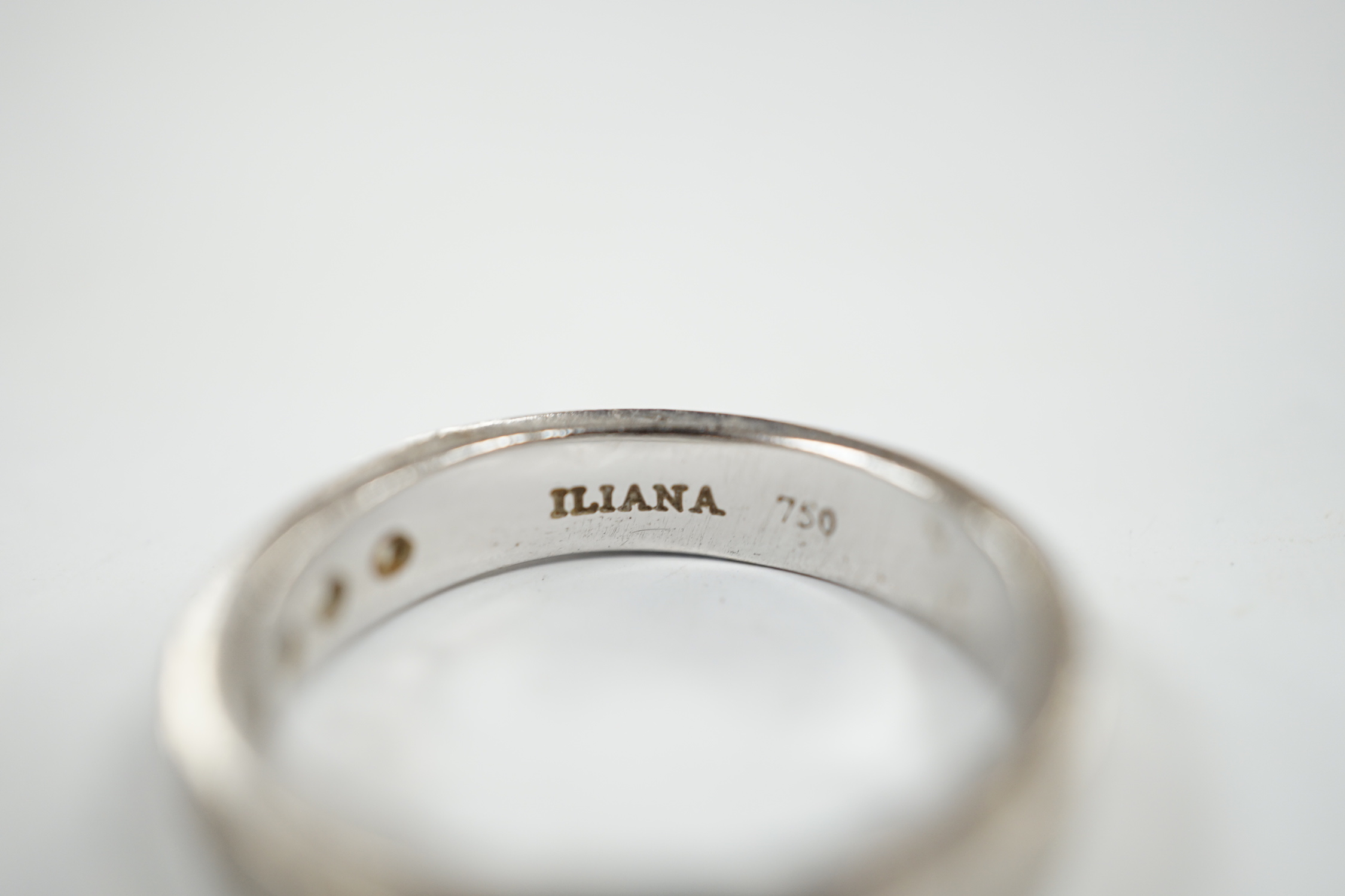 A modern Iliana 18ct white gold and nine stone channel set diamond half eternity ring, size R, gross weight 7.7 grams.